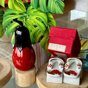 Lovely -  A delightful lacquerware egg plant toothpick holder/container and a fun vintage ornate Geta salt and pepper set - Made in Japan.
