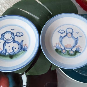 So cute! Two sweet signed collectible stoneware treat dishes - puppy and duck. M.A. Hadley. Adorable M.A. Hadley collectibles.