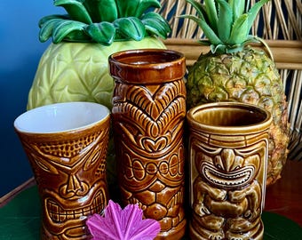 ALOHA! Get the tiki party started with these three fab vintage tiki time mugs. Tiki farm, Daga & Orchids of Hawaii. Fab collectible mugs.
