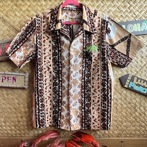 Fabulous Pomare Hawaii Aloha shirt. Wonderful tiki pattern in browns/tans. Fantastic tiki time shirt - 1960s-70s.  Mens large