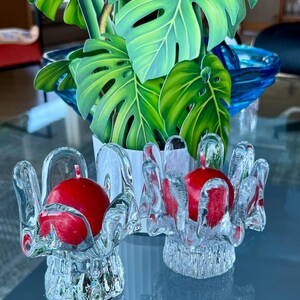 Two beautiful Kosta Boda Goran Warff Swedish candle holders.  Fun pattern & shape. Glass pedals and a thick pedestal base. Classic Boda.