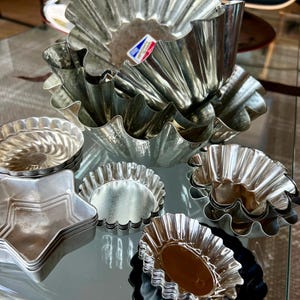 Fabulous! Four large French Brioche molds plus a variety of 31 molds - vintage jello molds, fluted tins, Swedish tins and more. Fun bundle.
