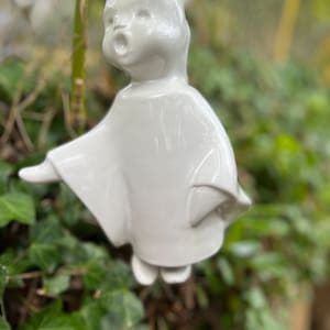 The sweetest Angel/girl ceramic wall hang- Indoor/outdoor decoration. Little feet sticking out which makes the bell sound.  Italy