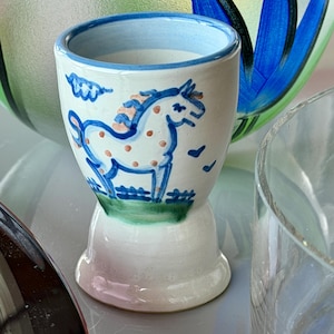 A signed collectible stoneware cup - M.A. Hadley.