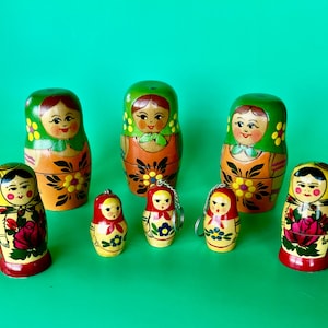 Eight  delightful Russian items - Five Matryoshka nesting dolls and three sweet key chains.  Lovely collectibles from Russia.