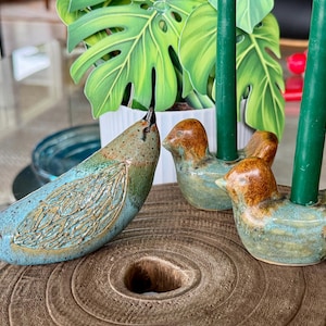 Three collectible birds - forged ceramic bird candle holders. Artist Douglas Ferguson - creator of pigeon forged pottery and bird sculpture.