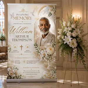 Puede incluir: Un cartel funerario vertical con el retrato de un hombre mayor con barba blanca, texto dorado IN LOVING MEMORY, William Arthur Thompson y fechas. El diseño incluye arreglos florales blancos, palomas y un icono de cruz.