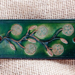 Green leather hair barrette.