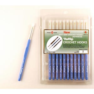 May include: A package of 10 Tulip brand crochet hooks, size 2, with soft grip handles. The hooks are made in Japan and are packaged in a clear plastic bag with a blue and white label.