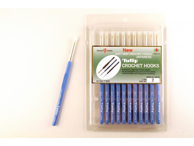 May include: A package of 10 Tulip brand crochet hooks, size 2, with soft grip handles. The hooks are made in Japan and are packaged in a clear plastic bag with a blue and white label.