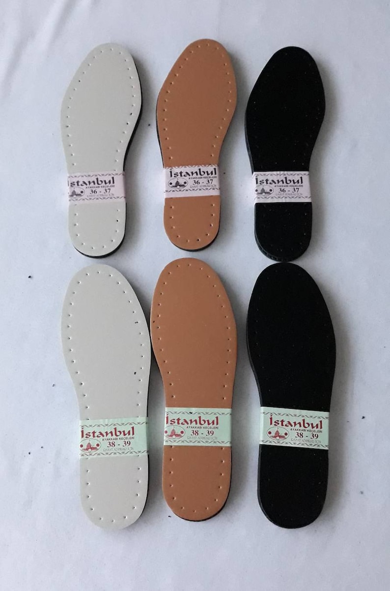 May include: Six leather shoe insoles in three colors: white, brown, and black. Each insole has a label with the text "Istanbul" and size numbers 36-37 or 38-39.