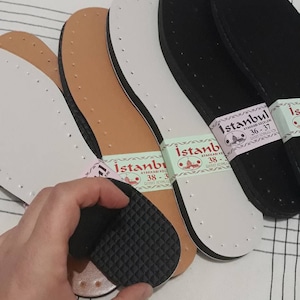 May include: Four pairs of shoe insoles, two brown, one white, and one black. The insoles have a label that reads "Istanbul Ayakkabı Ke&ccedil;eleri" with sizes 36-37, 38-39, and 38-39.