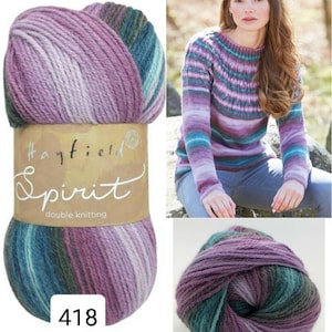 May include: A skein of Hayfield Spirit double knitting yarn in color 418. The yarn is a multi-colored blend of purple, green, and grey. The yarn is shown in a ball and on a skein with a label that says "Hayfield Spirit double knitting".