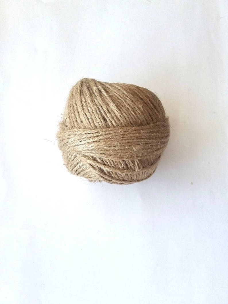 May include: A ball of natural brown twine or string.