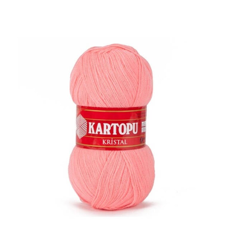 May include: A ball of pink yarn with a red label that says "KARTOPU KRISTAL".