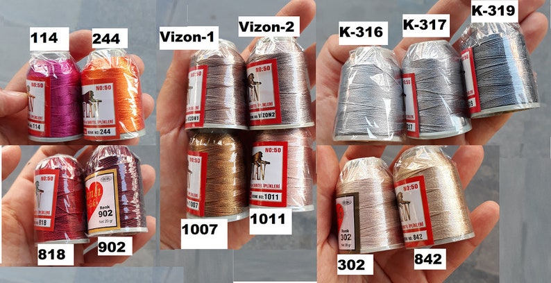 May include: Assortment of spools of thread in various colors, including red, orange, brown, gold, silver, and gray. The spools are labeled with numbers and names, such as "114", "244", "Vizon-1", "Vizon-2", "K-316", "K-317", "K-319", "1007", "1011", "302", "818", "902", and "842".