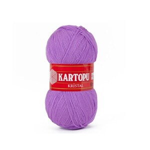 May include: A skein of purple yarn with the label "KARTOPU KRISTAL" in red.