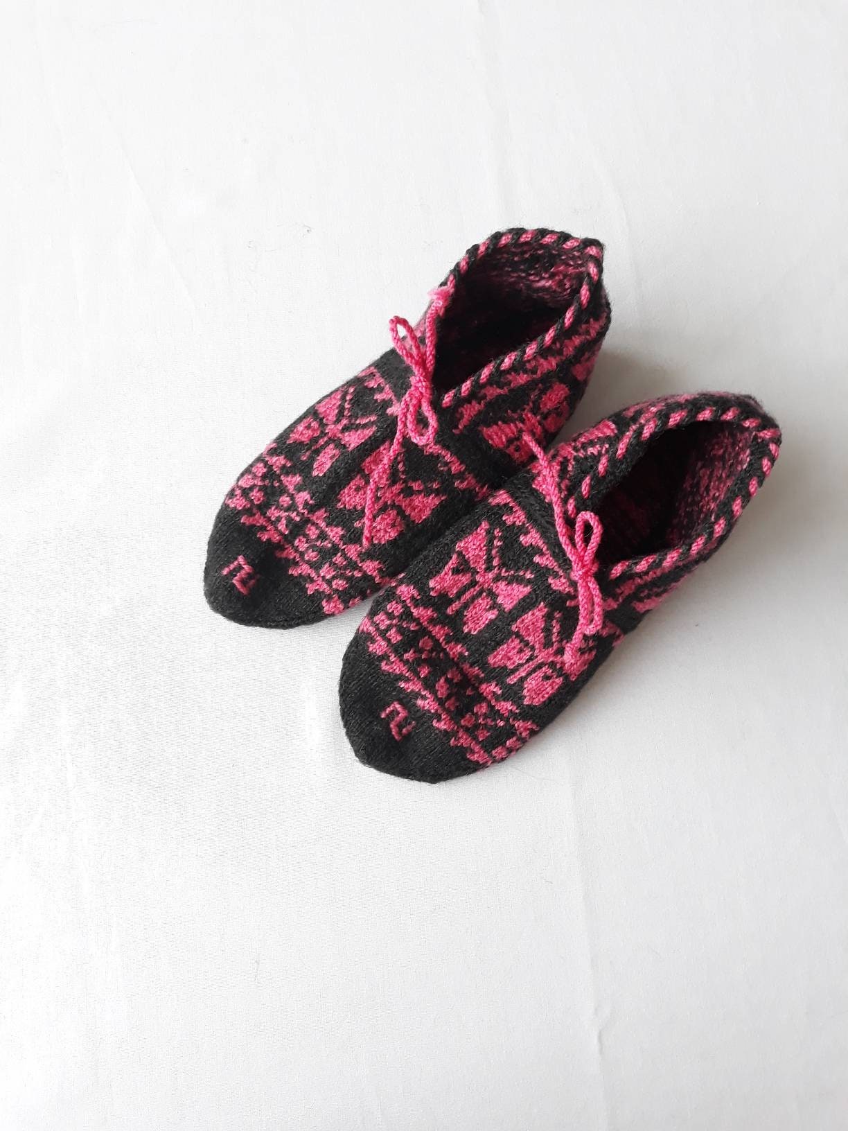 pink and black slippers