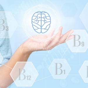 May include: A light blue graphic illustration featuring a central blue brain icon surrounded by a circular pattern. Hexagonal shapes containing the text B1, B2, B3, B5, B6, B9, and B12 are arranged around the brain, set against a soft blue background.