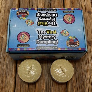 Kawaii-Dumpling-Squishy-Überraschungsbox-Spielzeug in zufälliger Farbe – sensorischer Stressabbau-Spaß