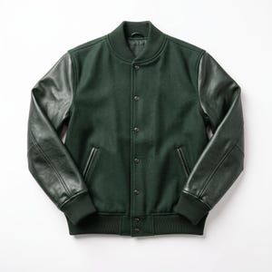 May include: A dark forest green varsity jacket featuring a wool-blend body and contrasting dark green leather sleeves. The jacket includes a ribbed collar, cuffs, and hem, a front snap-button closure, and two side pockets with leather trim detailing.