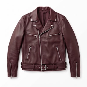 May include: A deep burgundy leather motorcycle jacket featuring a notched collar with silver-tone snap buttons, an asymmetrical front zipper closure, three zippered pockets on the front, zippered cuffs, and an adjustable waist belt with a buckle.