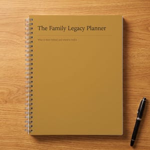 May include: A mustard yellow spiral-bound planner with the text The Family Legacy Planner and the subtitle What to leave behind, and where to find it printed in dark brown on the front cover, accompanied by a black ballpoint pen.