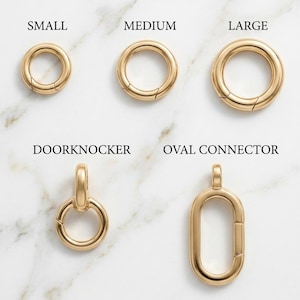 May include: A collection of gold-toned metal jewelry clasps and connectors. The set includes three circular rings labeled Small, Medium, and Large, a Doorknocker style ring with a bail, and an elongated Oval Connector with a hinged opening mechanism.