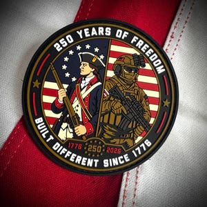 May include: A circular morale patch featuring a split design of a colonial soldier and a modern soldier. Text reads 250 YEARS OF FREEDOM and BUILT DIFFERENT SINCE 1776, with the years 1776, 250, and 2026 displayed in the center against a flag background.