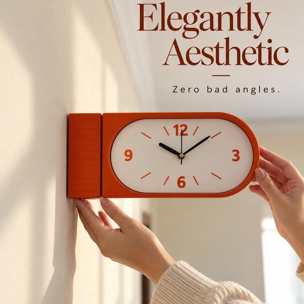 May include: An orange wall clock with a white face, black hands, and orange numerals for 3, 6, 9, and 12. The clock has a rounded rectangular shape and is mounted to a wall. The text "Elegantly Aesthetic" and "Zero bad angles." appears above.