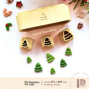 May include: A light yellow rectangular storage container with a tree icon, three square cookie cutters with tree-shaped centres, and several small green tree-shaped cutouts. The text Digital Download, Bambu Lab, and Include STL & 3MF Files for Bambu Studio are visible.
