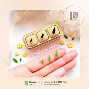 May include: A beige rectangular mold with three square cavities, each containing a teardrop-shaped insert. The text "Pearnmade Cutters Digital Download" is printed below the mold. Small yellow flower and green leaf shapes are scattered nearby.