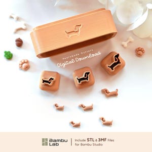 May include: A set of light brown 3D printed cookie cutters featuring dachshund shapes, including a large rectangular frame and three smaller square cutters, with small dachshund-shaped cutouts and the text Pearnmade Cutters Digital Download.