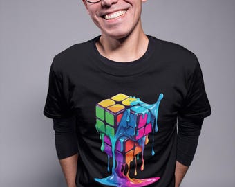 May include: A black long-sleeve t-shirt featuring a graphic print of a colorful Rubik's cube that appears to be melting with vibrant blue, pink, yellow, and green liquid drips pooling at the bottom of the design on the front of the garment.
