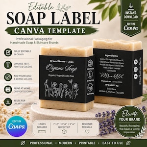 May include: An editable Canva template for soap labels featuring two bars of textured beige soap wrapped in black paper bands. The labels display white floral line art, text including Organic Soap, ingredient lists, and social media icons.