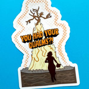 May include: A die-cut sticker featuring a dark silhouette of a person running toward a large, pale yellow flame topped with a bare brown tree. The text 'YOU HAD YOUR QUALMS?!' is printed in bold orange letters with black outlines over the flame.