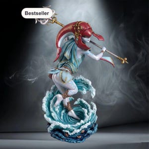 May include: A fantasy figurine of a pale-skinned aquatic character with a red headpiece, wearing light blue and gold clothing, holding a long golden spear. The character stands atop a sculpted base of swirling blue ocean waves with small seashells.