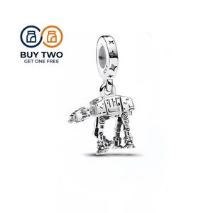 May include: A silver charm shaped like a four-legged walker vehicle with intricate mechanical detailing and a bail stamped with S925 and star motifs. The charm features a metallic finish and is designed to be worn on a bracelet or necklace chain.
