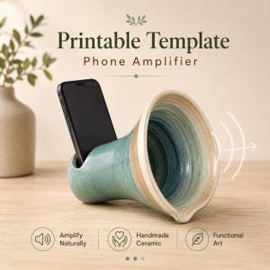 May include: A ceramic phone amplifier with a blue and beige swirled glaze, featuring a slot for a smartphone. The text reads Printable Template Phone Amplifier, Amplify Naturally, Handmade Ceramic, and Functional Art with sound wave icons.