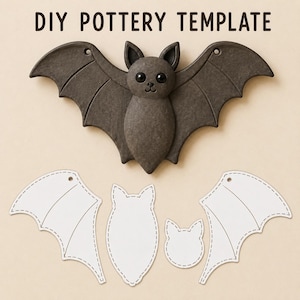 May include: A dark gray bat-shaped pottery piece with black eyes and a small nose, positioned above three white paper templates with dashed outlines. The text DIY POTTERY TEMPLATE is printed in dark brown letters at the top of the image.