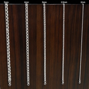 May include: Five silver-toned box chains of varying thicknesses, labeled from left to right as 5mm, 4mm, 3mm, 2.5mm, and 2mm. Each chain features a repeating square link design and a small lobster claw clasp at the bottom end of the chain.