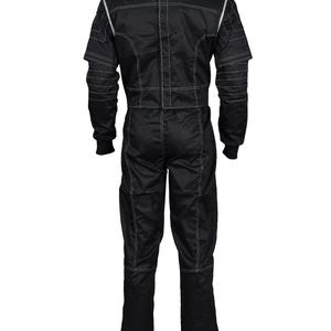 May include: A black racing jumpsuit featuring long sleeves with ribbed cuffs, a high collar, and light-colored contrast stitching throughout. The garment includes grey shoulder panels and a vertical zipper closure running down the center back.