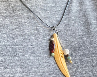 tribal boho feather necklace, masculine leather bone necklace, modern Native American style, carved bone leaf hippy chic pendant