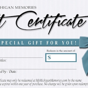 May include: A blue and white gift certificate with the text "MY MICHIGAN MEMORIES Gift Certificate" and "A VERY SPECIAL GIFT FOR YOU!"  The certificate has a blue ribbon with a bow at the top right corner. The certificate has a space to fill in the amount of the gift certificate.