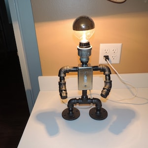 Black pipe table lamp robot with light switch