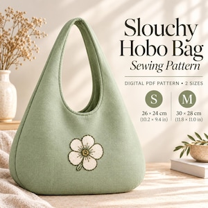 May include: A sage green slouchy hobo bag sewing pattern featuring a white embroidered flower on the front. The text reads Slouchy Hobo Bag Sewing Pattern, Digital PDF Pattern, 2 sizes, S 10.2 x 9.4 inches, and M 11.8 x 11.0 inches.
