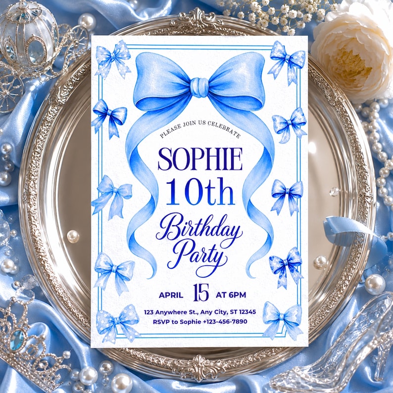 May include: A rectangular birthday party invitation card featuring a large watercolor blue bow at the top and smaller blue bows along the border. The text reads: PLEASE JOIN US CELEBRATE SOPHIE 10th Birthday Party APRIL 15 AT 6PM 123 Anywhere St., Any City, ST 12345 RSVP to Sophie +123-456-7890.