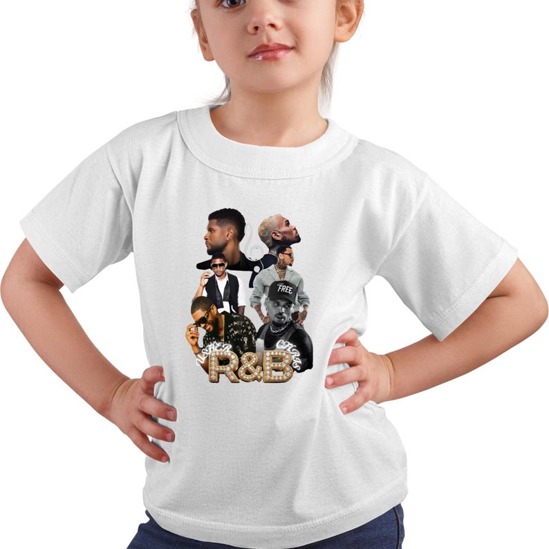 May include: A white short-sleeved t-shirt featuring a graphic print of multiple portraits of two male singers. Below the portraits, the text R&B is displayed in a large, gold, studded font, with the names Usher and Chris written in smaller script.