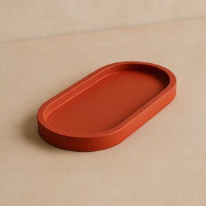 Minimalistisk oval orange betongbricka | Handgjord dekorativ displaytallrik i jesmonit