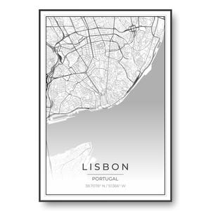 May include: A framed map print of Lisbon, Portugal, featuring a detailed black and white street grid on a light gray background. The text LISBON, PORTUGAL, and the coordinates 38.7078 N / 9.1366 W are printed in black at the bottom of the poster.